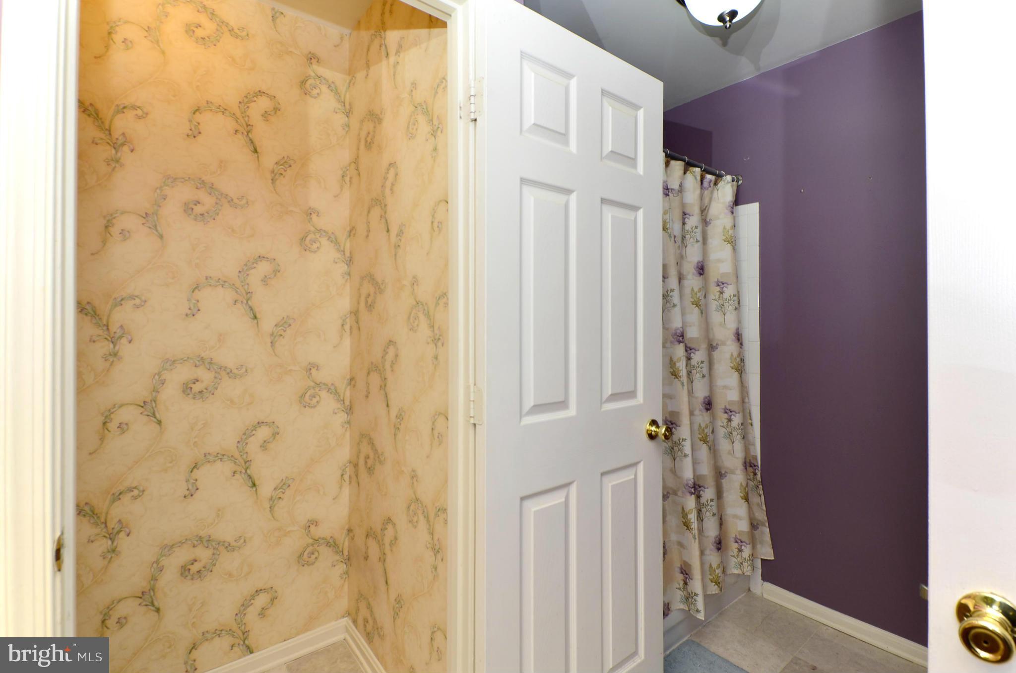 4462 Silver Teal Road Baltimore, MD 21236 - Photo 20 of 30 a bathroom with a shower curtain