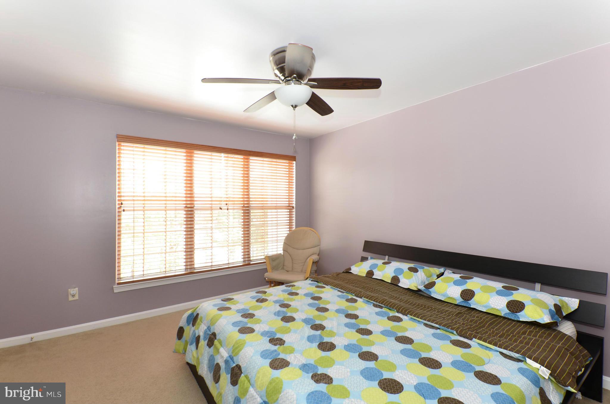 4462 Silver Teal Road Baltimore, MD 21236 - Photo 21 of 30 a bedroom with a bed and a window