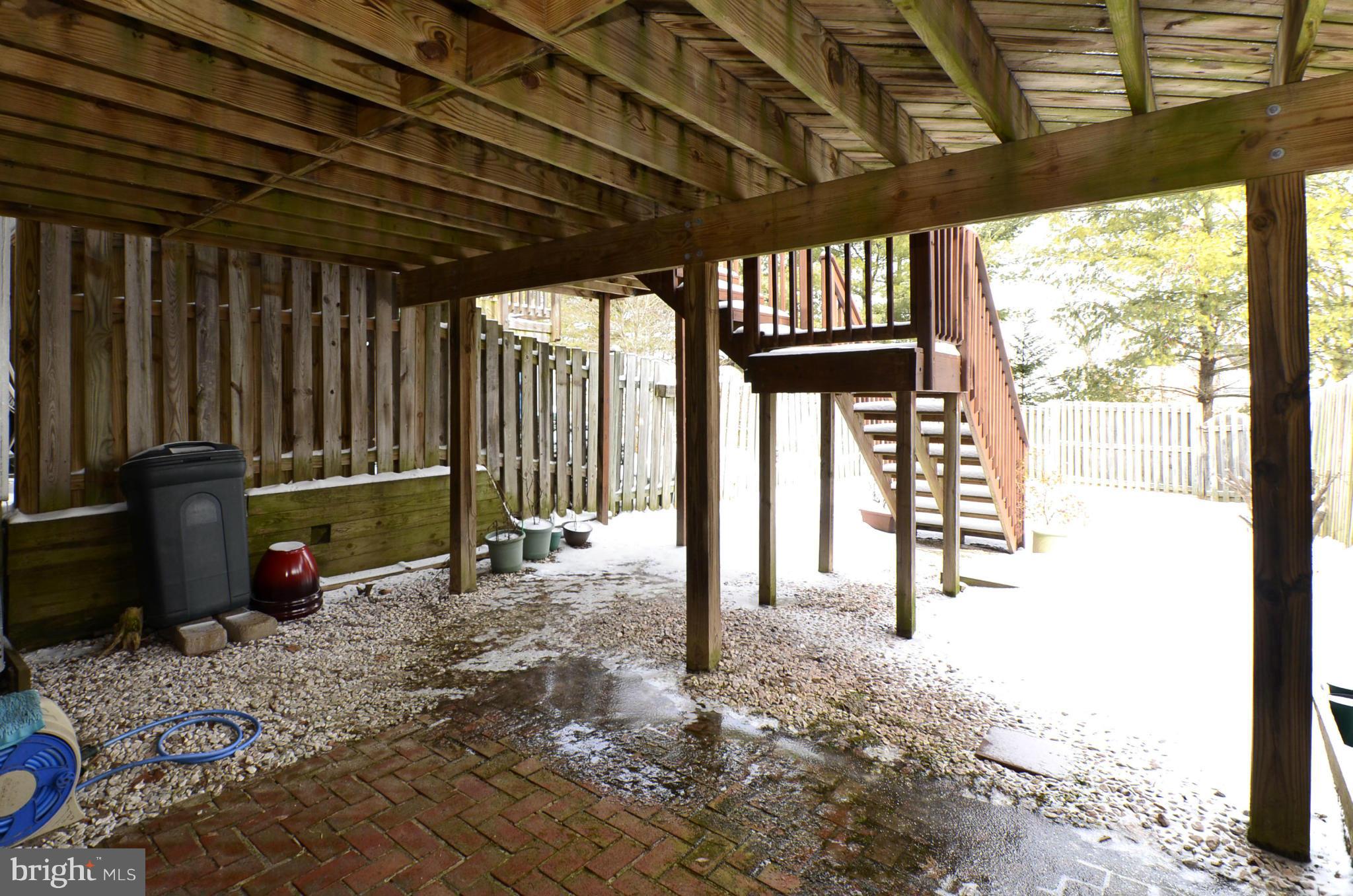 4462 Silver Teal Road Baltimore, MD 21236 - Photo 27 of 30 a view of a porch with a table and a chairs