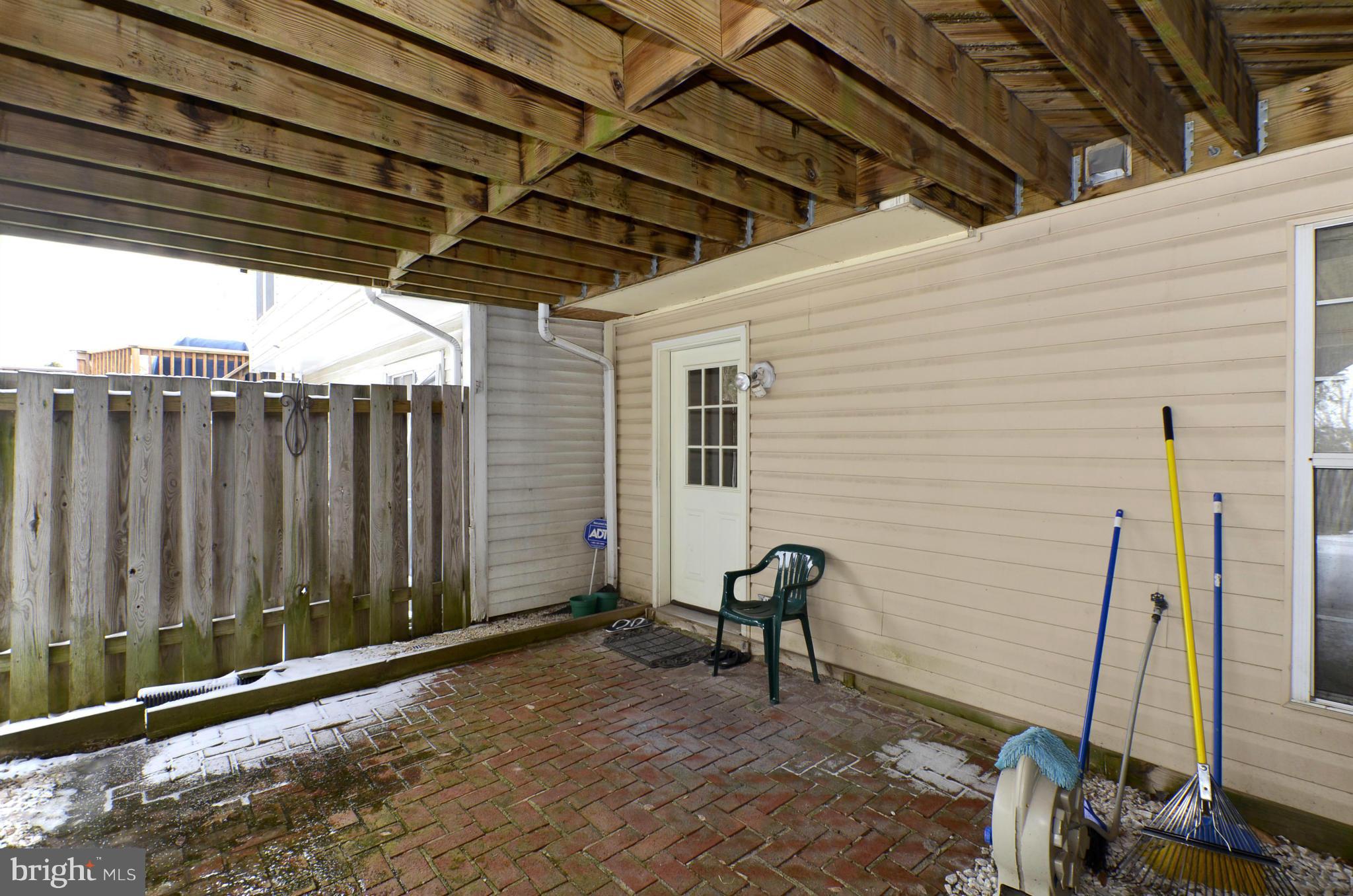 4462 Silver Teal Road Baltimore, MD 21236 - Photo 28 of 30 a view of a backyard with furniture and floor to ceiling window