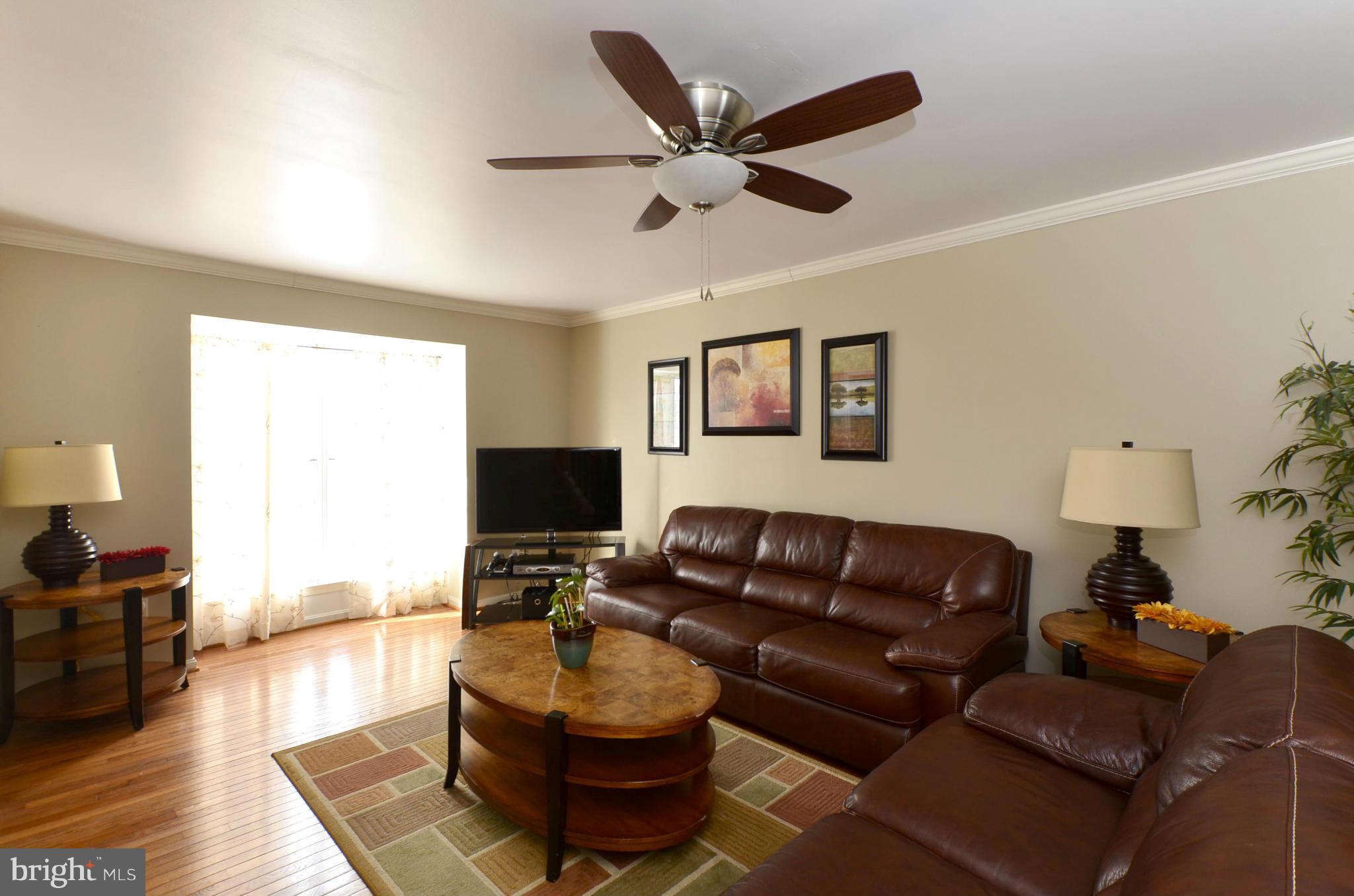 4462 Silver Teal Road Baltimore, MD 21236 - Photo 4 of 30 a living room with furniture and a wooden floor