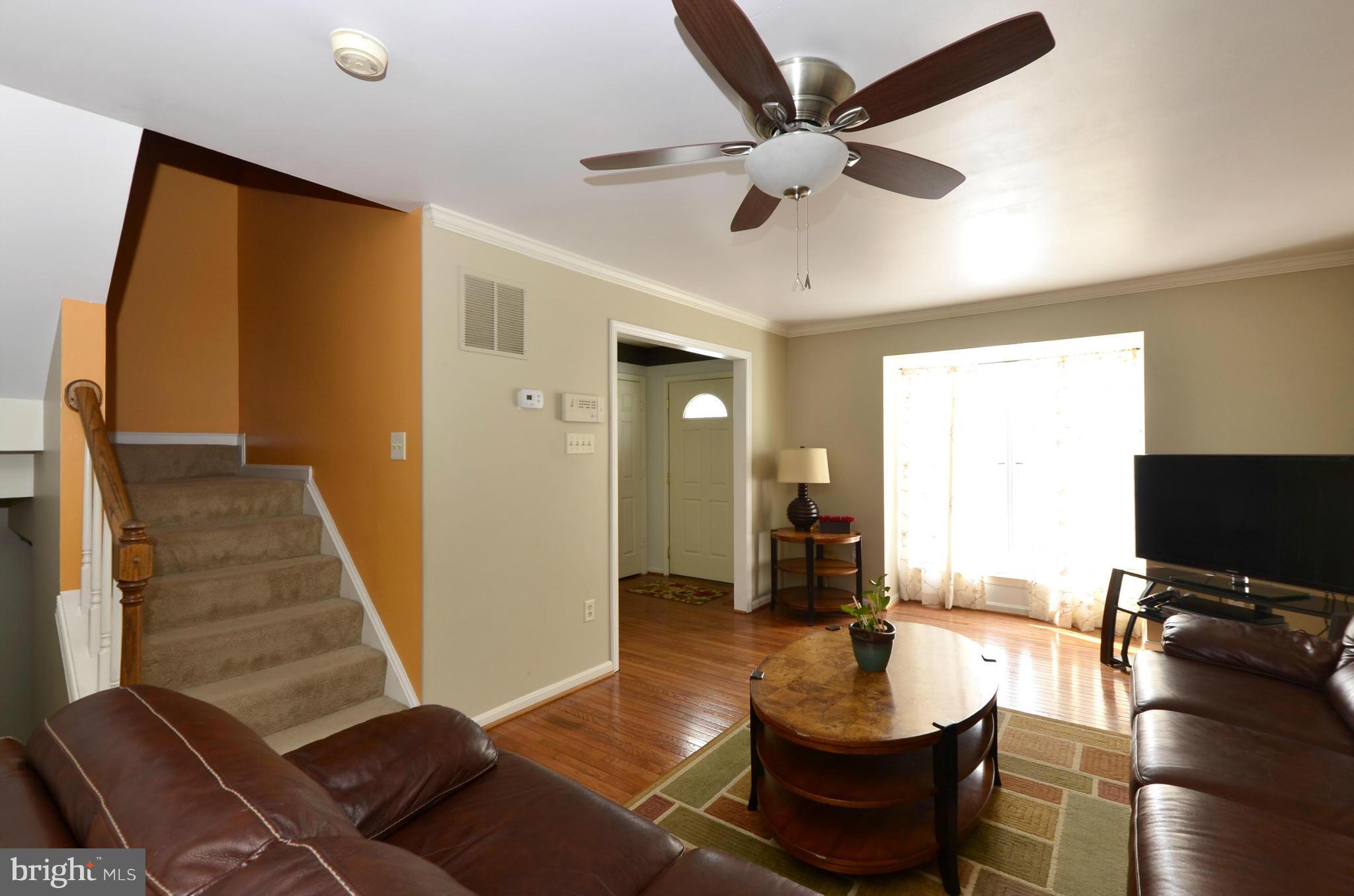 4462 Silver Teal Road Baltimore, MD 21236 - Photo 6 of 30 a living room with furniture and a flat screen tv
