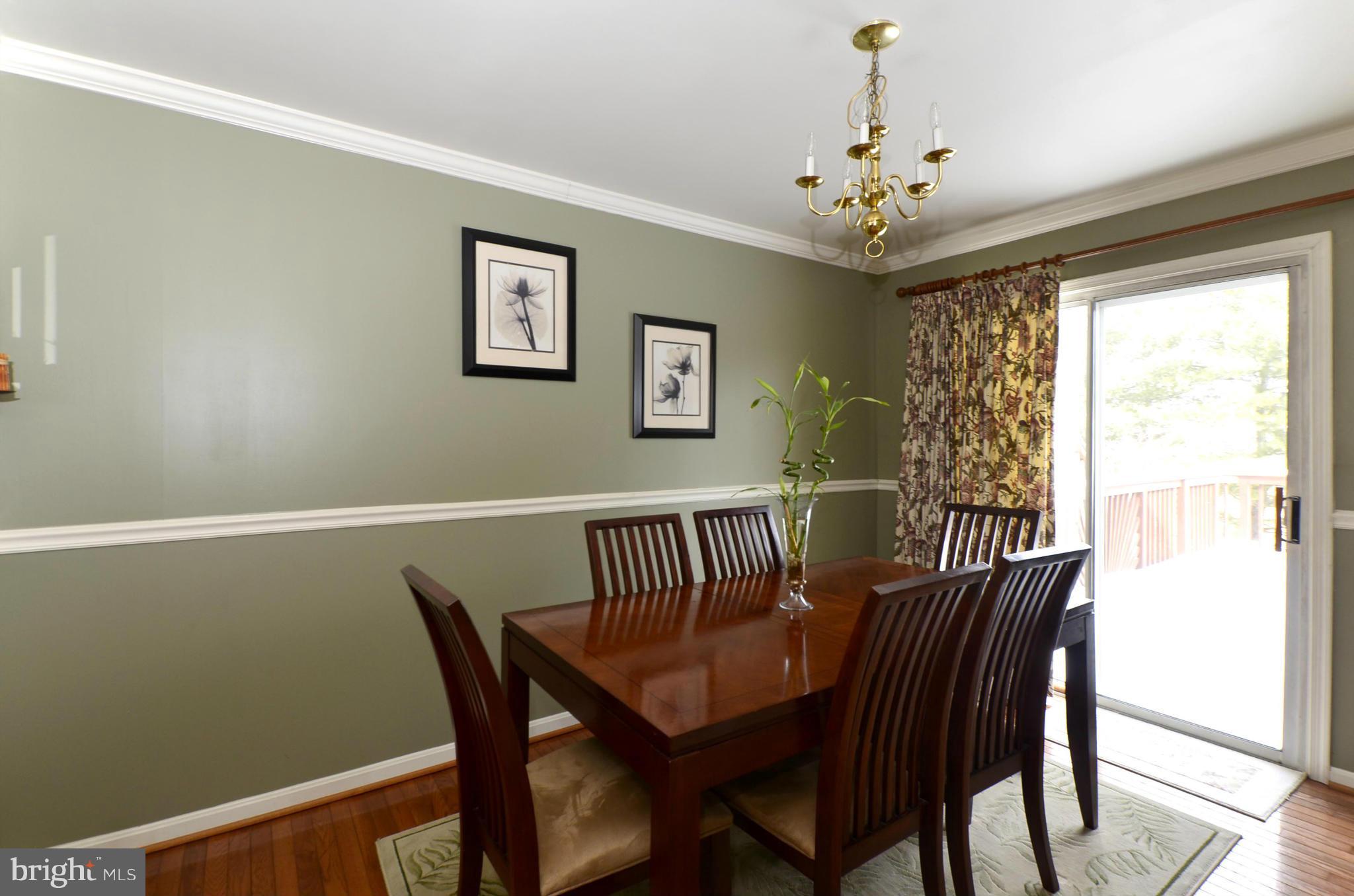 4462 Silver Teal Road Baltimore, MD 21236 - Photo 8 of 30 a view of a dining room with furniture window and wooden floor