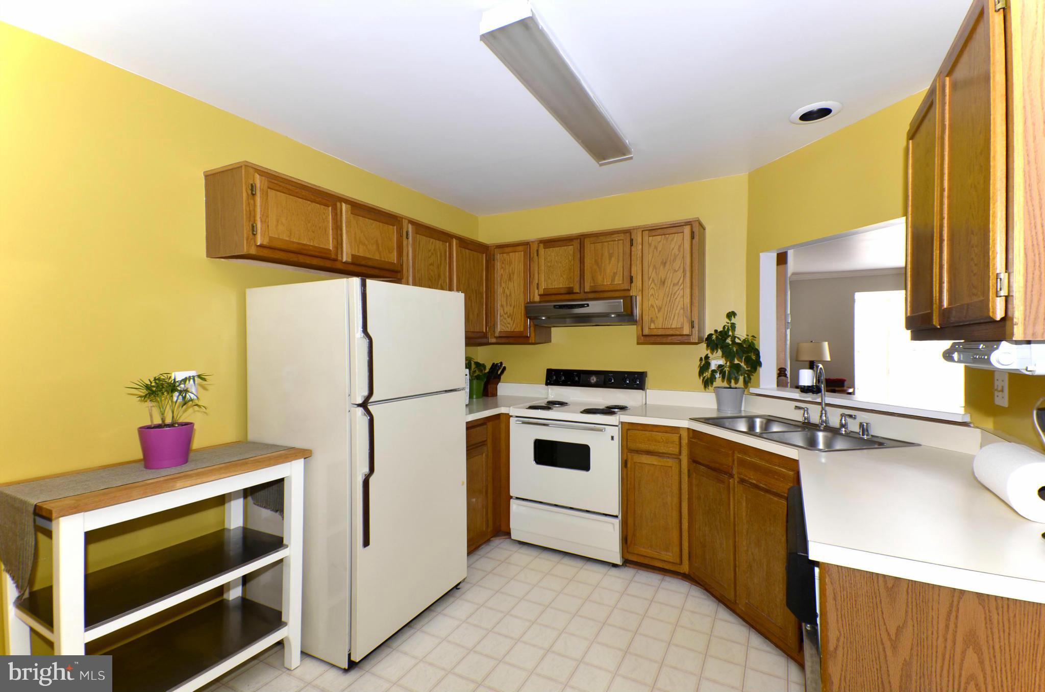 4462 Silver Teal Road Baltimore, MD 21236 - Photo 10 of 30 a kitchen with a sink appliances and cabinets