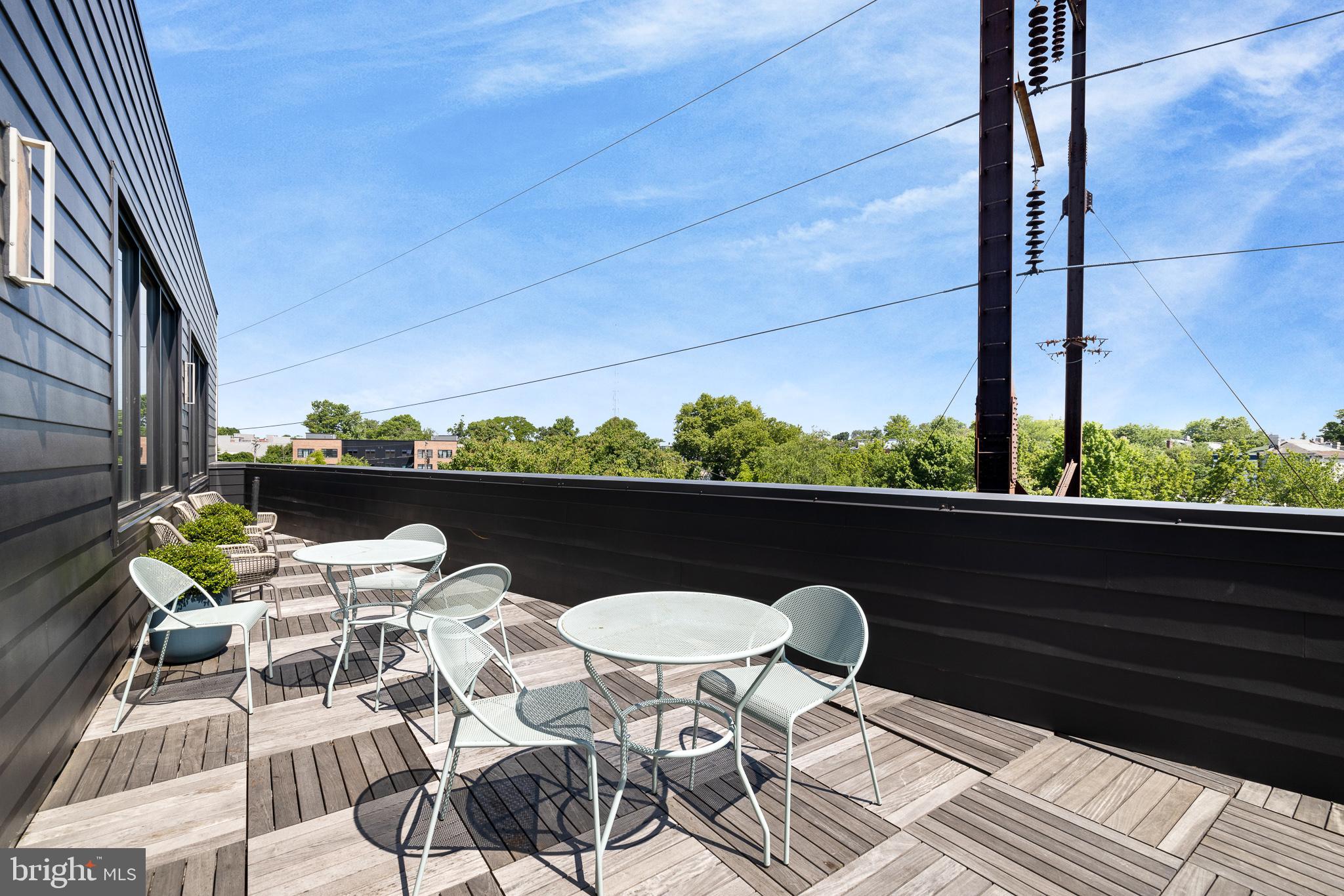 5013 Springfield Avenue, Unit 408 Philadelphia, PA 19143 - Photo 15 of 15 a view of a balcony with chairs and a table