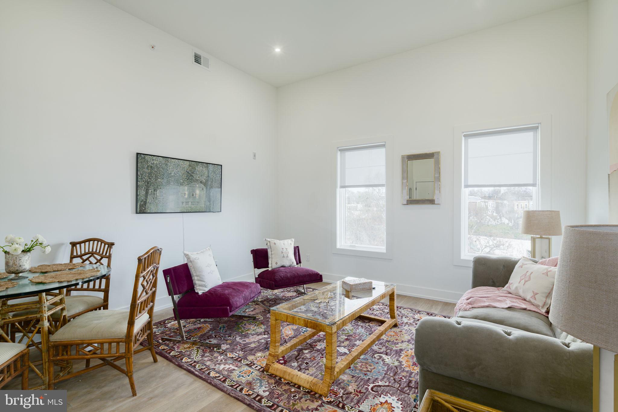 5013 Springfield Avenue, Unit 408 Philadelphia, PA 19143 - Photo 3 of 15 a living room with furniture and a window