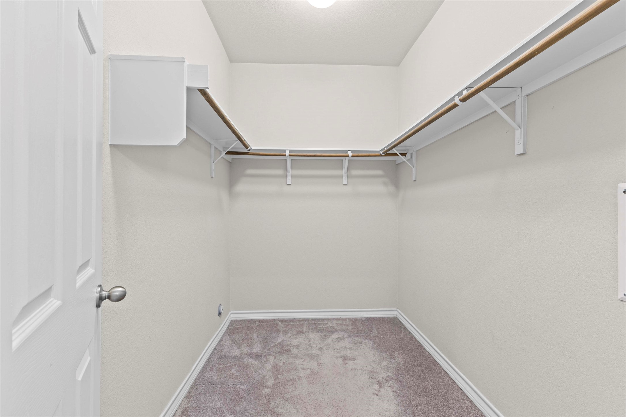 11704 Prado Ranch Boulevard Austin, TX 78725 - Photo 17 of 29 Walk in closet off of the primary bathroom.