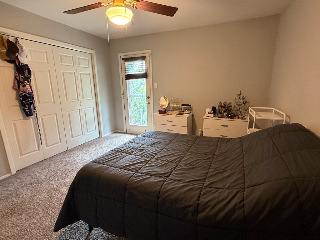 816 Ramble Lane, Unit B Austin, TX 78745 - Photo 15 of 27 a bed sitting in a bedroom next to a window