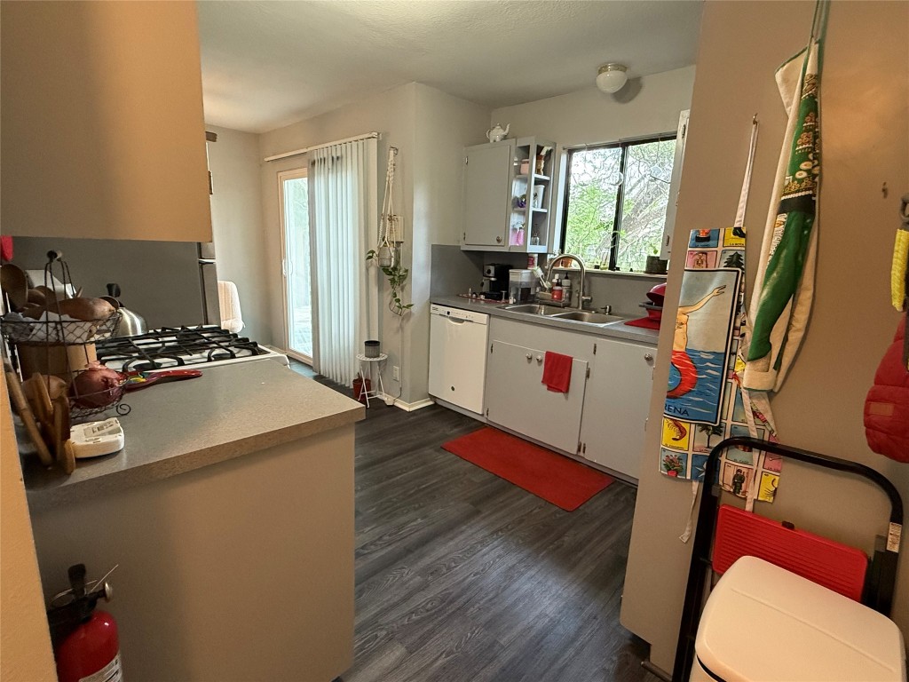 816 Ramble Lane, Unit B Austin, TX 78745 - Photo 20 of 27 a kitchen with a refrigerator and a stove top oven