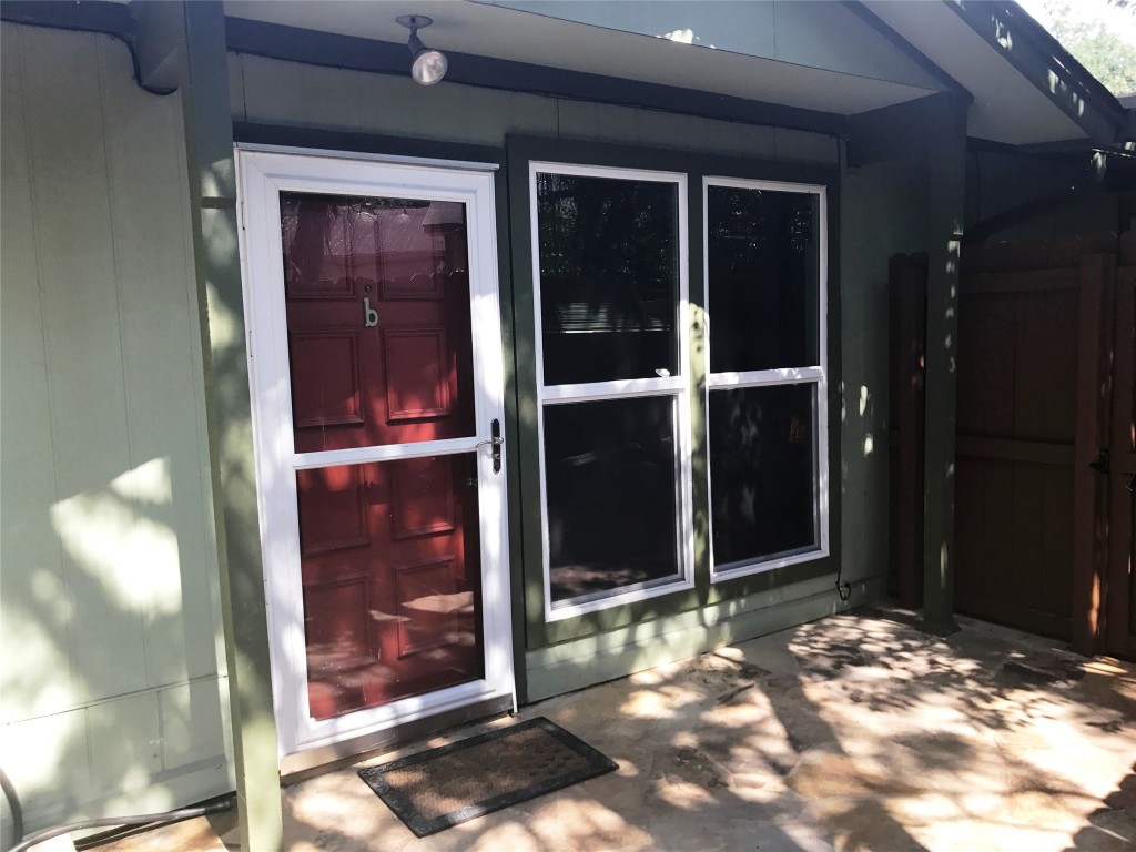 816 Ramble Lane, Unit B Austin, TX 78745 - Photo 2 of 27 a view of a wooden door