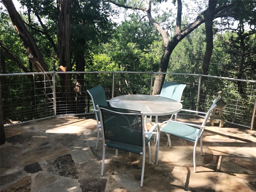 816 Ramble Lane, Unit B Austin, TX 78745 - Photo 3 of 27 a view of a chairs and table on the wooden floor
