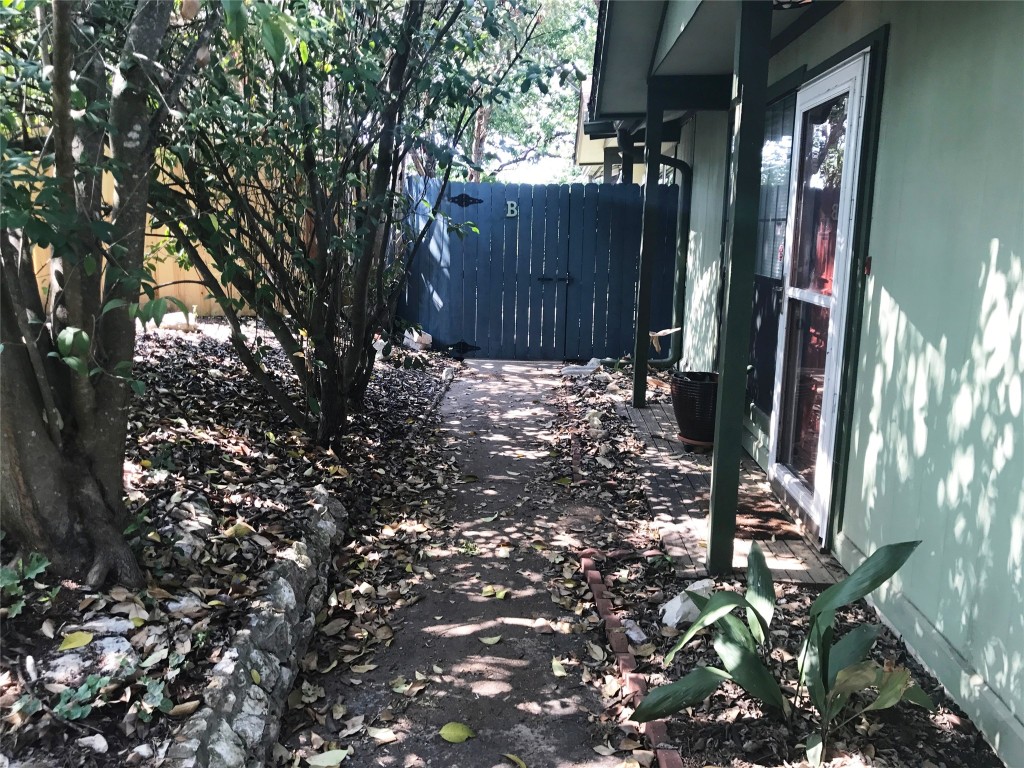 816 Ramble Lane, Unit B Austin, TX 78745 - Photo 4 of 27 a view of a backyard of the house