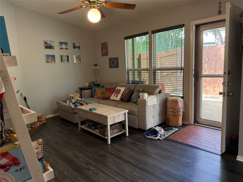 816 Ramble Lane, Unit B Austin, TX 78745 - Photo 5 of 27 a bedroom with a bed and wooden floor