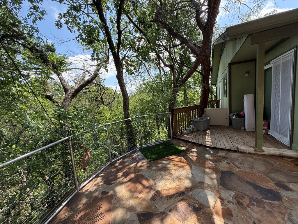 816 Ramble Lane, Unit B Austin, TX 78745 - Photo 9 of 27 a view of a wooden house with a large tree