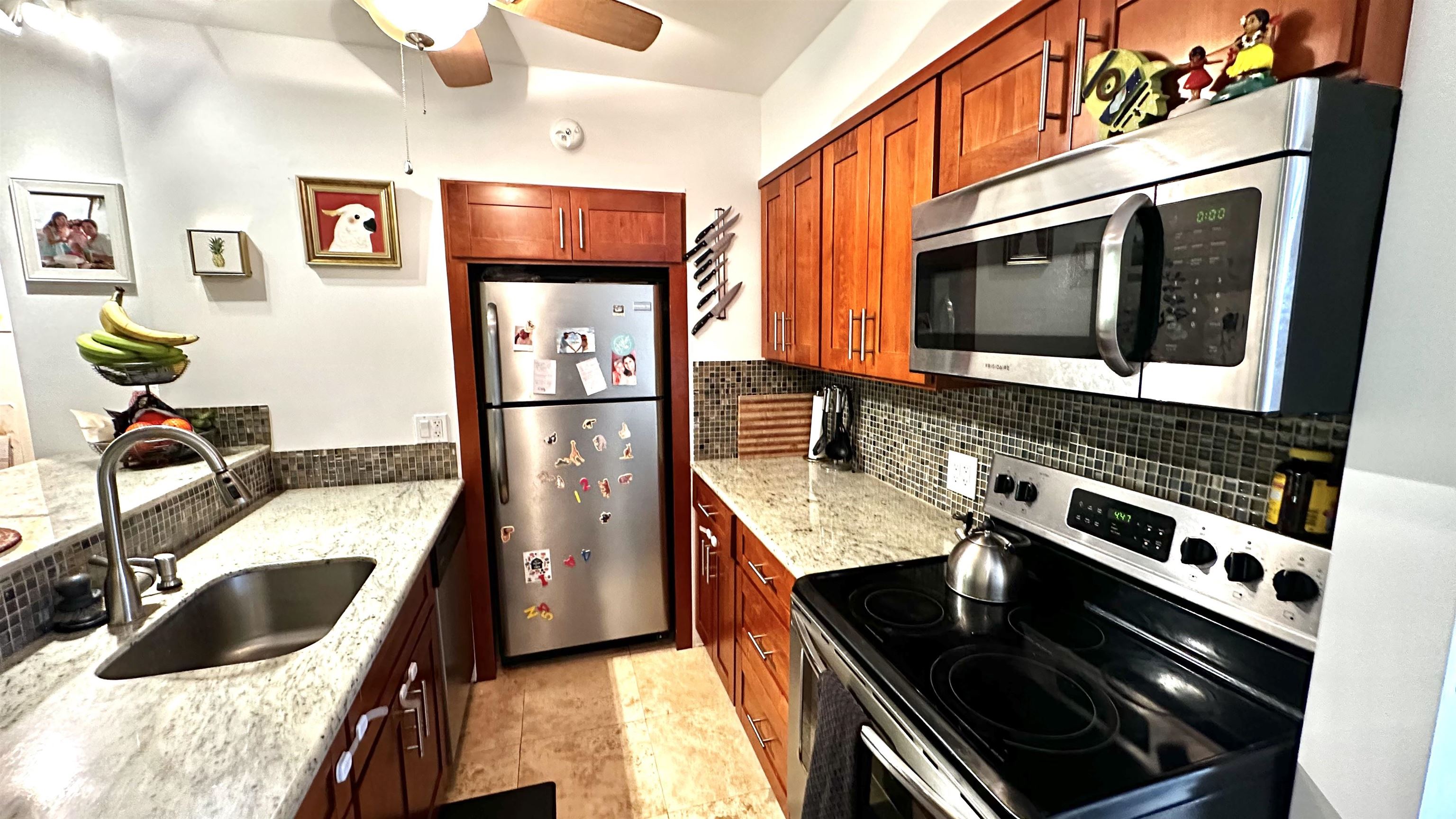 a kitchen with stainless steel appliances granite countertop a stove and a sink