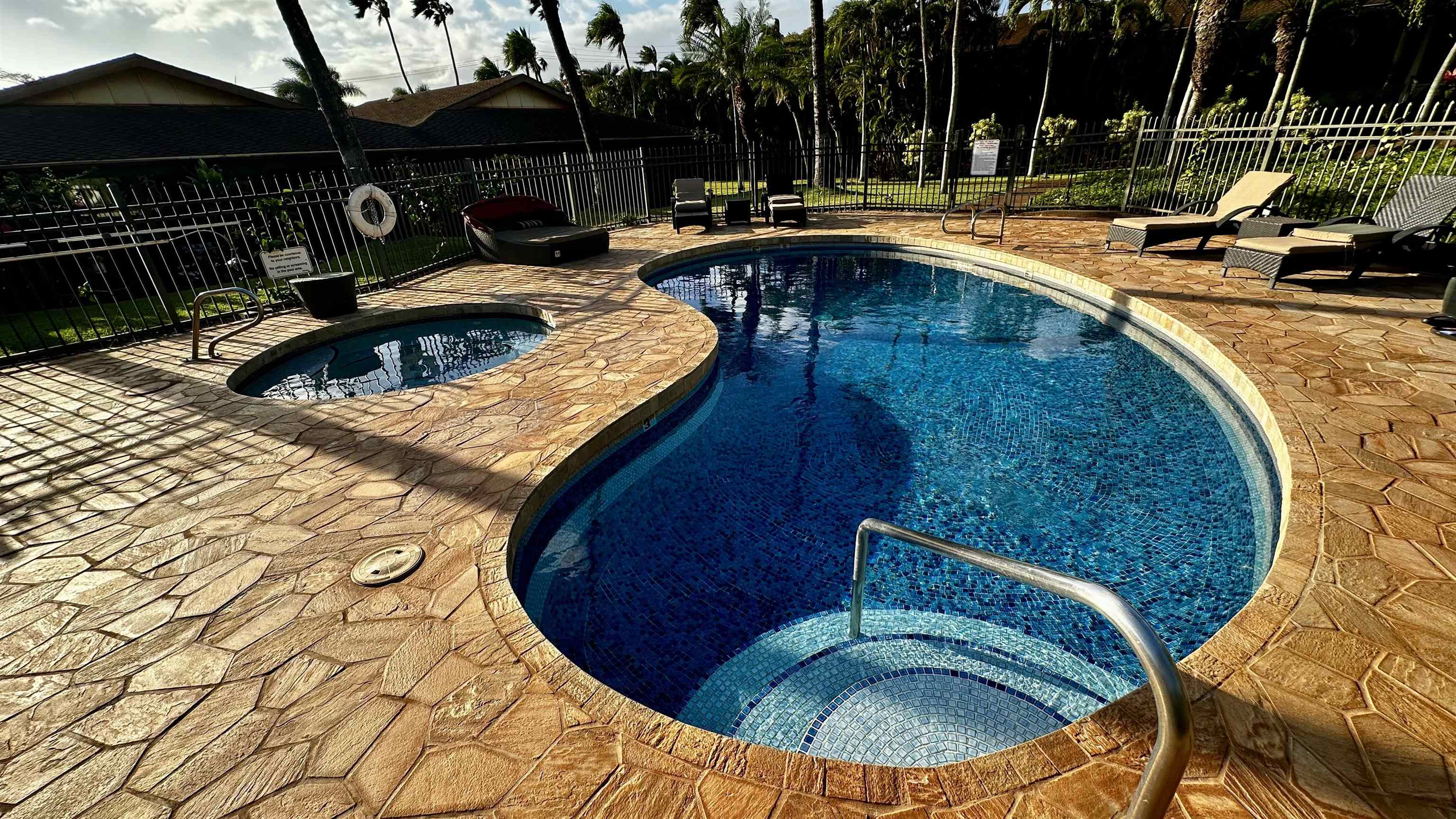 3788 Lower Honoapiilani Road, Unit A208 Lahaina, HI 96761 - Photo 16 of 23 a view of a swimming pool with a patio