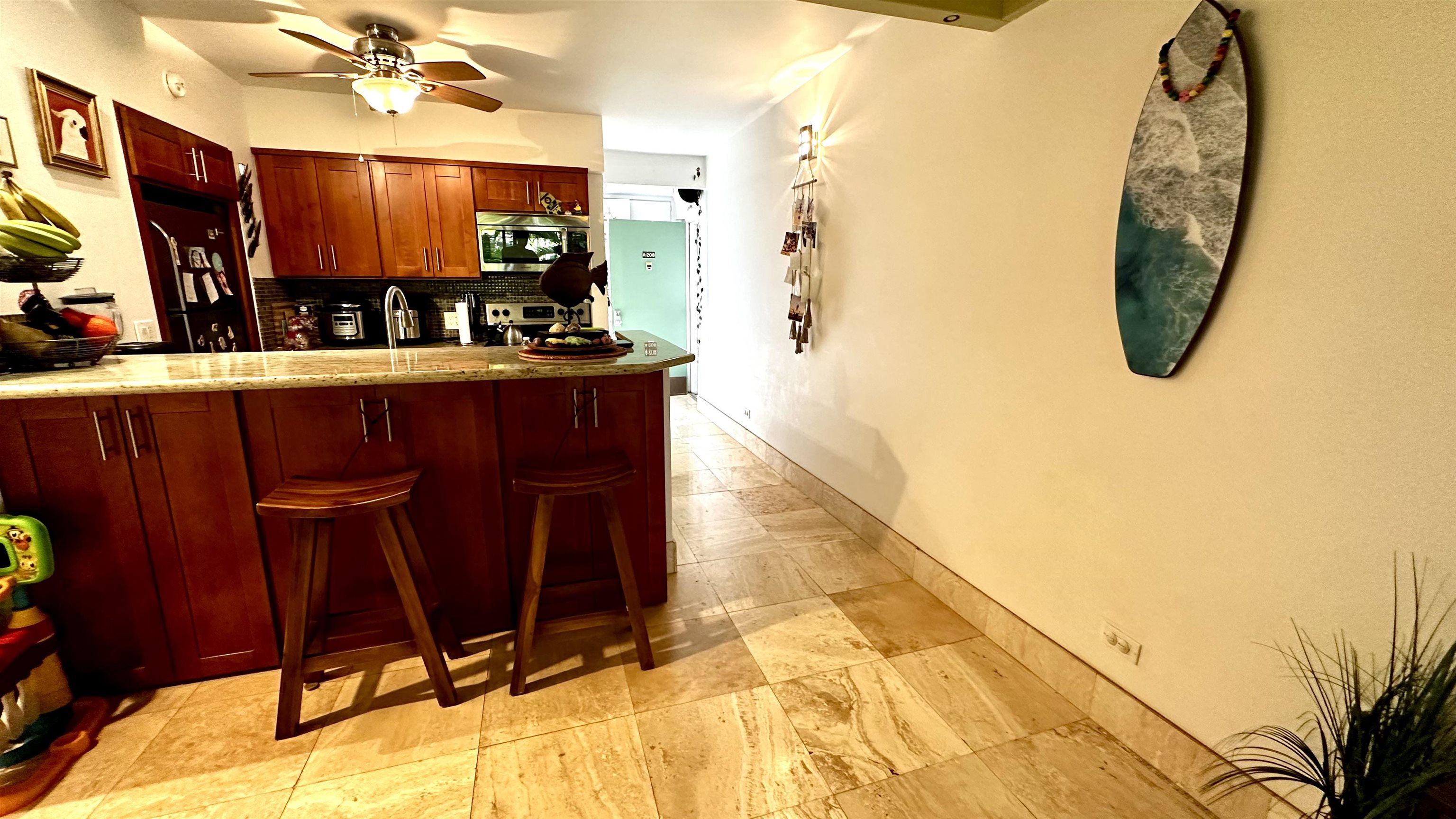 3788 Lower Honoapiilani Road, Unit A208 Lahaina, HI 96761 - Photo 6 of 23 a bathroom with a sink mirror and vanity