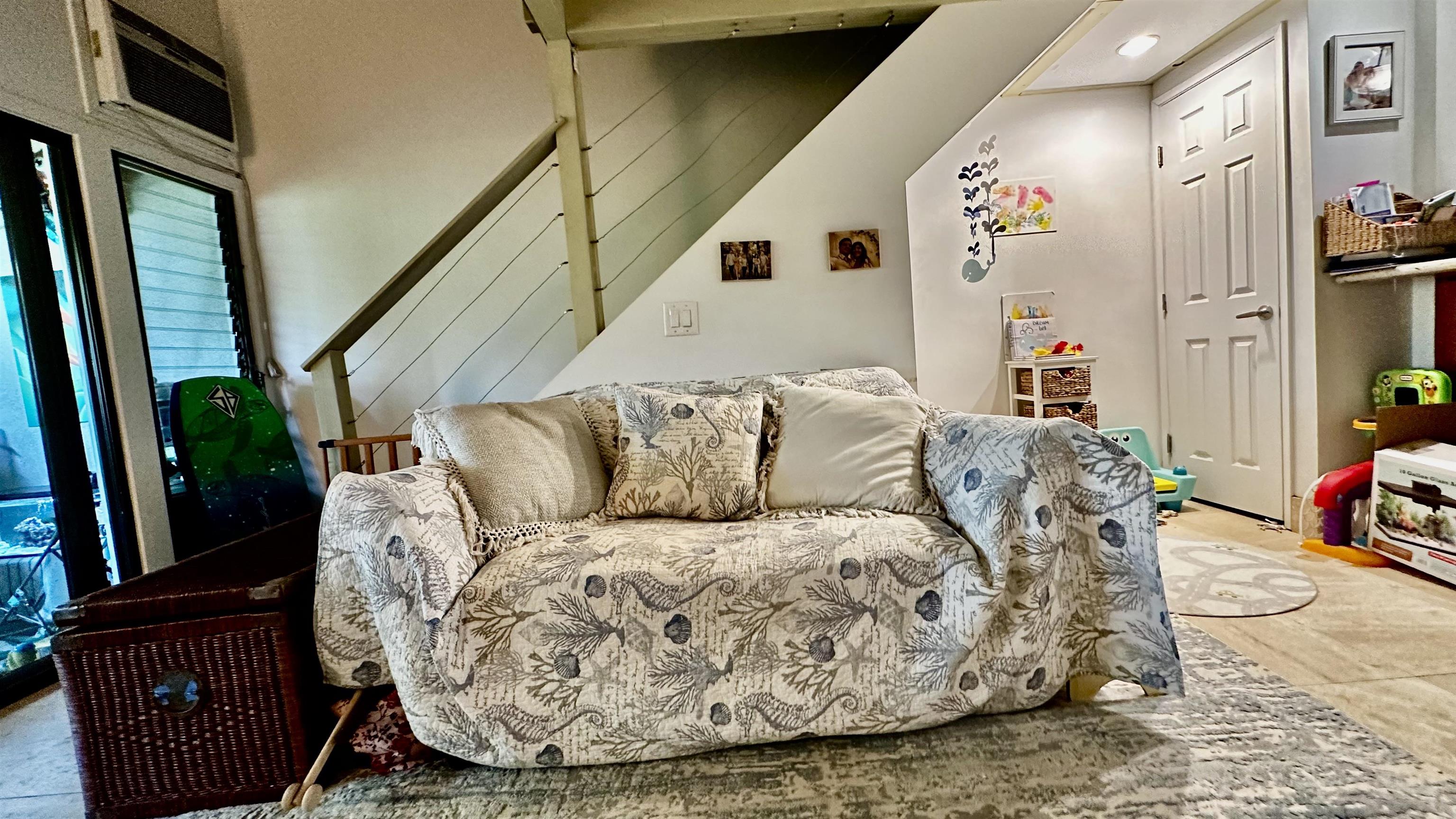 3788 Lower Honoapiilani Road, Unit A208 Lahaina, HI 96761 - Photo 7 of 23 a living room with furniture fireplace and mirror