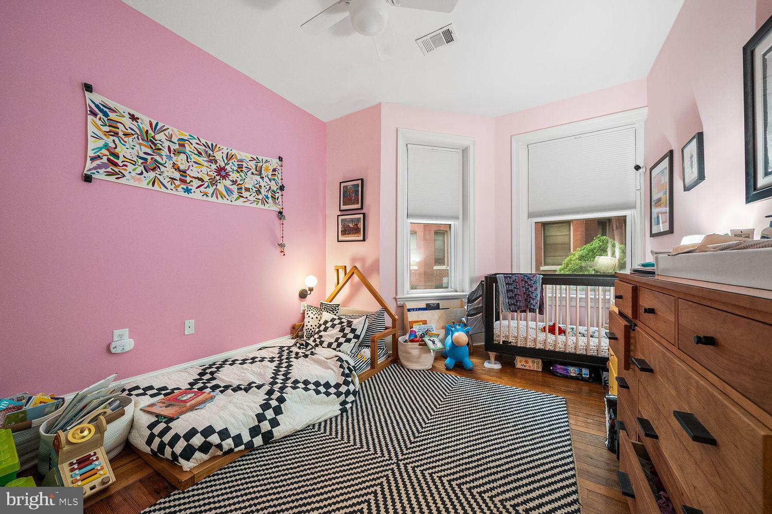 1423 R Street Northwest, Unit 105 Washington, DC 20009 - Photo 20 of 32 a bedroom with furniture and a window