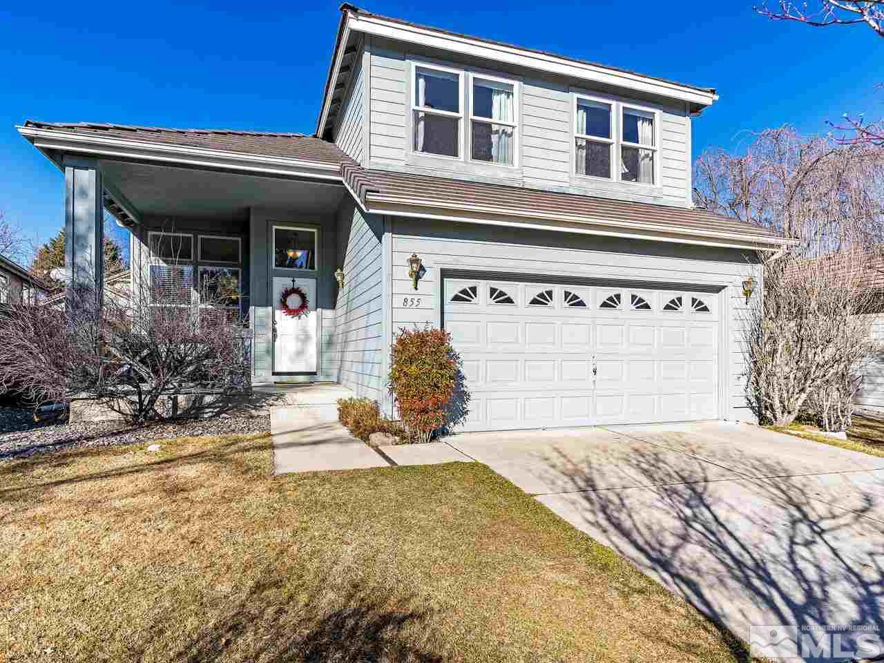 855 Caughlin Crossing Reno, NV 89519 - Photo 1 of 25 a front view of a house with a yard
