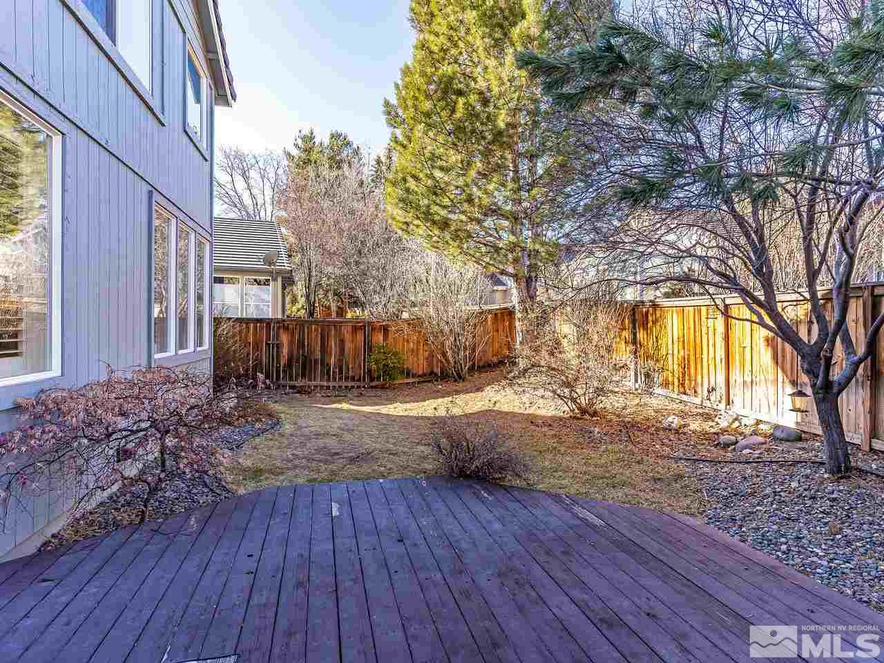 855 Caughlin Crossing Reno, NV 89519 - Photo 24 of 25 a view of a yard with wooden fence