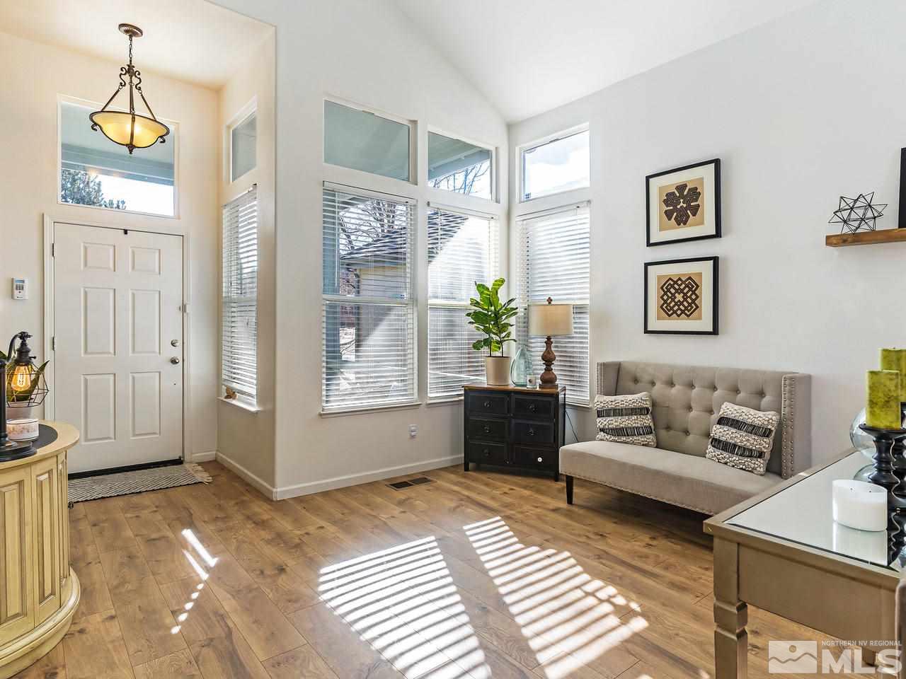 855 Caughlin Crossing Reno, NV 89519 - Photo 4 of 25 a living room with furniture and a window