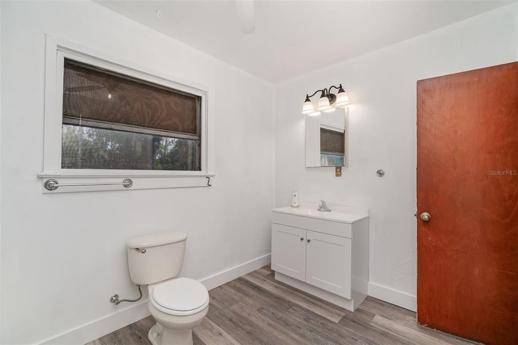2729 Broadway Fort Myers, FL 33901 - Photo 19 of 49 a bathroom with a toilet sink and mirror