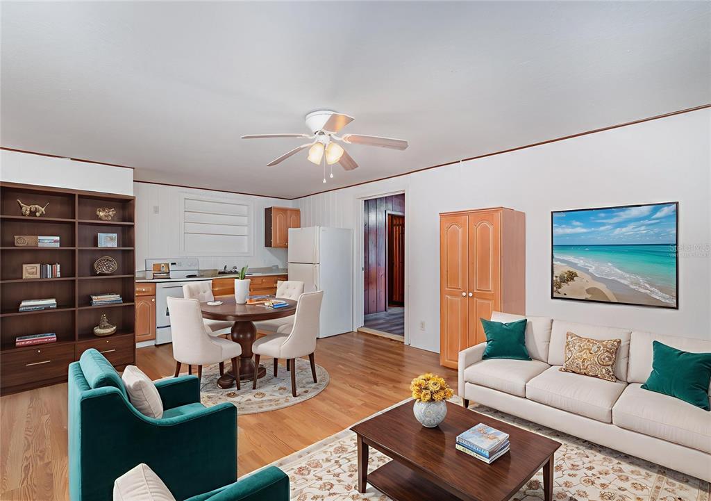 2729 Broadway Fort Myers, FL 33901 - Photo 24 of 49 a living room with furniture a chandelier and a bookshelf
