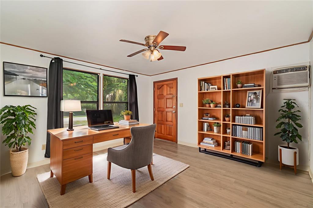 2729 Broadway Fort Myers, FL 33901 - Photo 29 of 49 a view of a workspace with furniture window and wooden floor