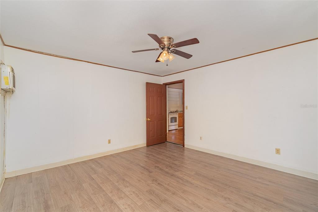 2729 Broadway Fort Myers, FL 33901 - Photo 31 of 49 a view of a room with wooden floor and white walls