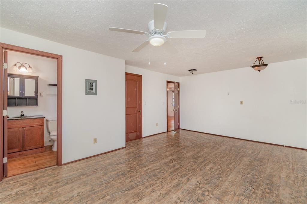 2729 Broadway Fort Myers, FL 33901 - Photo 33 of 49 a view of an empty room with a window and a kitchen