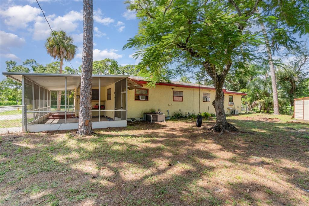 2729 Broadway Fort Myers, FL 33901 - Photo 39 of 49 a view of a house with backyard porch and sitting area