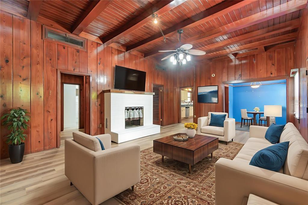 2729 Broadway Fort Myers, FL 33901 - Photo 4 of 49 a living room with furniture a fireplace and a flat screen tv