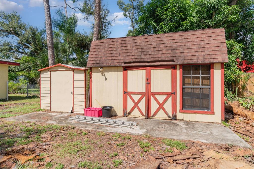 2729 Broadway Fort Myers, FL 33901 - Photo 42 of 49 a backyard of a house with table and chairs