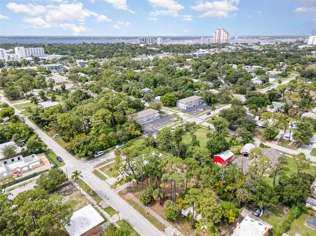 an aerial view of residential houses with city view