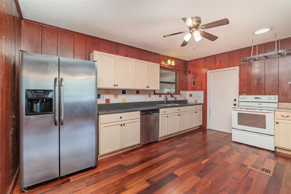 2729 Broadway Fort Myers, FL 33901 - Photo 10 of 49 a kitchen with a refrigerator sink and cabinets