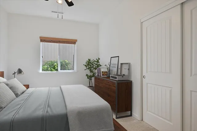 a bedroom with a bed and a dresser