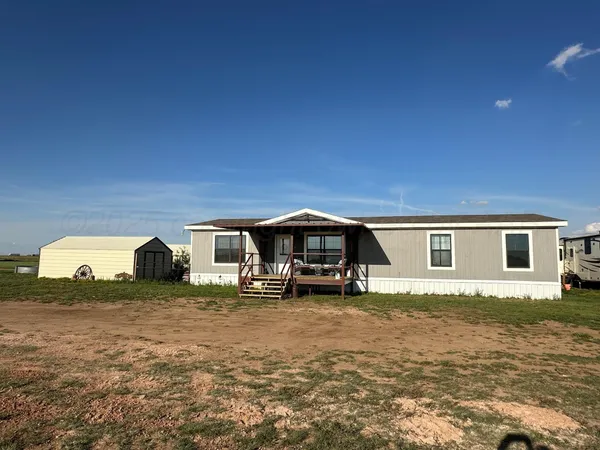 a view of a house with a big yard