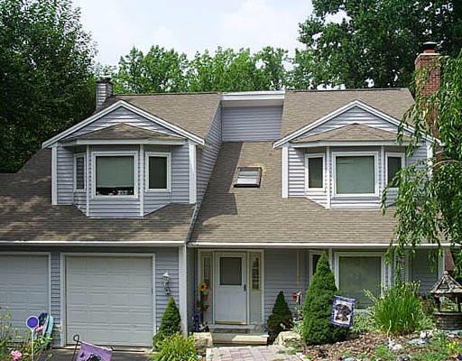 51 Old Sawmill Road Trumbull, CT 06611 - Photo 1 of 1 a front view of a house with a yard