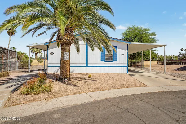 a house with palm tree in front of it
