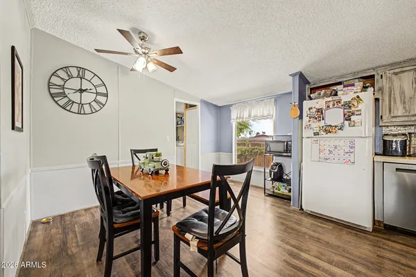 a dining room with furniture and a window