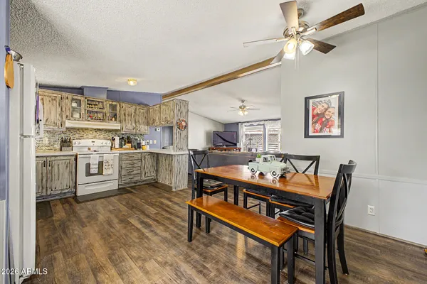 a dining room with furniture and window