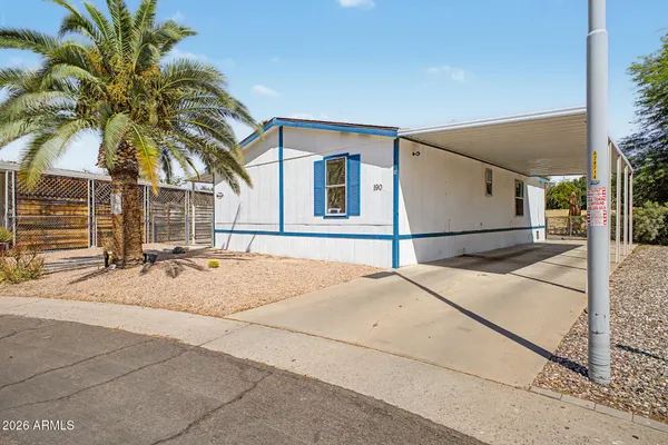 a house with palm tree in front of it