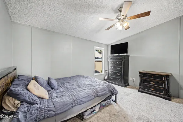 a bedroom with a bed and furniture