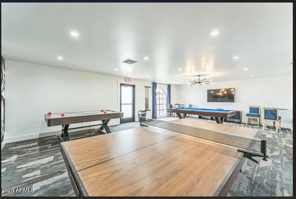 a room with lots of tables and chairs