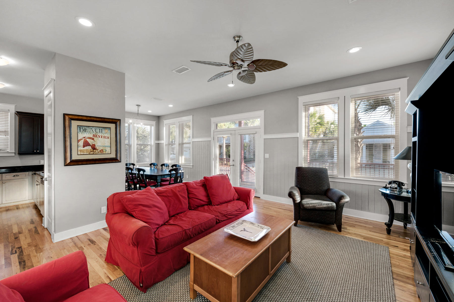 41 East Blue Crab Loop Inlet Beach, FL 32461 - Photo 16 of 63 a living room with furniture ceiling fan and a large window