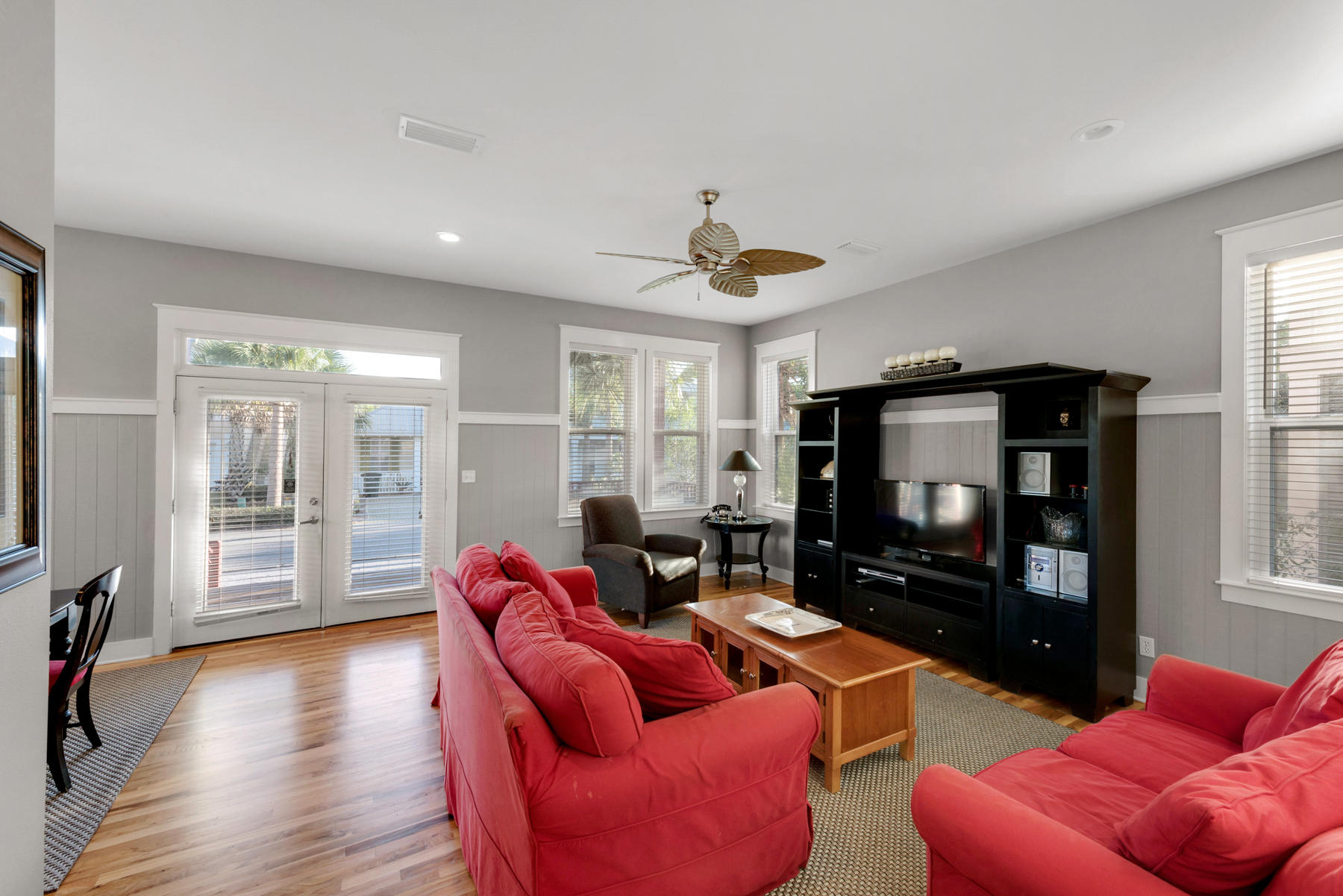 41 East Blue Crab Loop Inlet Beach, FL 32461 - Photo 24 of 63 a living room with furniture a flat screen tv and a fireplace