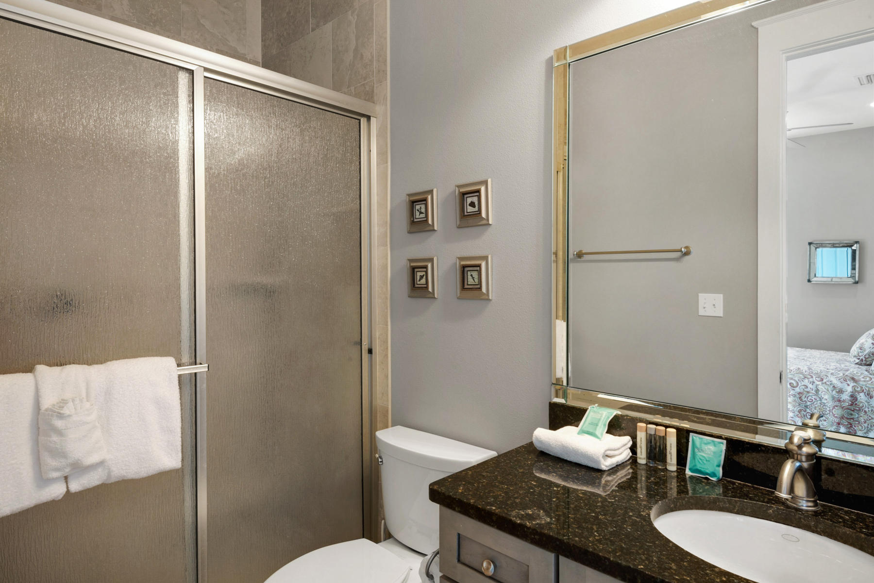 41 East Blue Crab Loop Inlet Beach, FL 32461 - Photo 38 of 63 a bathroom with a granite countertop sink toilet a mirror and shower