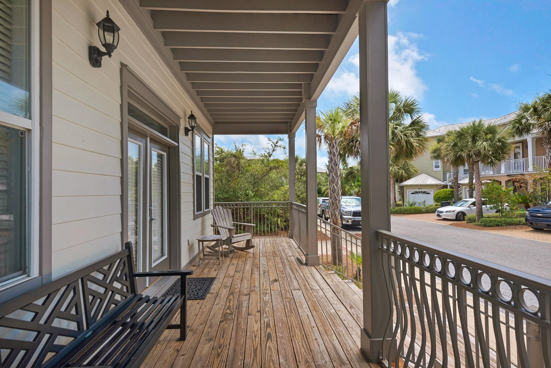 41 East Blue Crab Loop Inlet Beach, FL 32461 - Photo 5 of 63 a view of a porch with wooden floor and outdoor seating