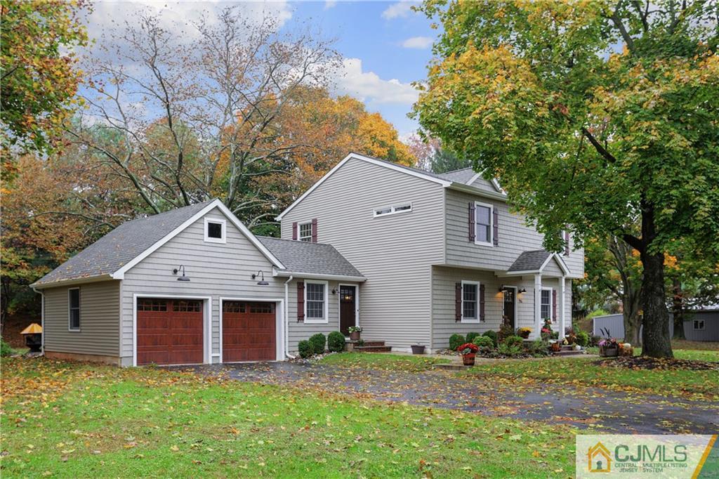 556 Ridge Road Monmouth Junction, NJ 08852 - Photo 16 of 19 a front view of a house with a yard